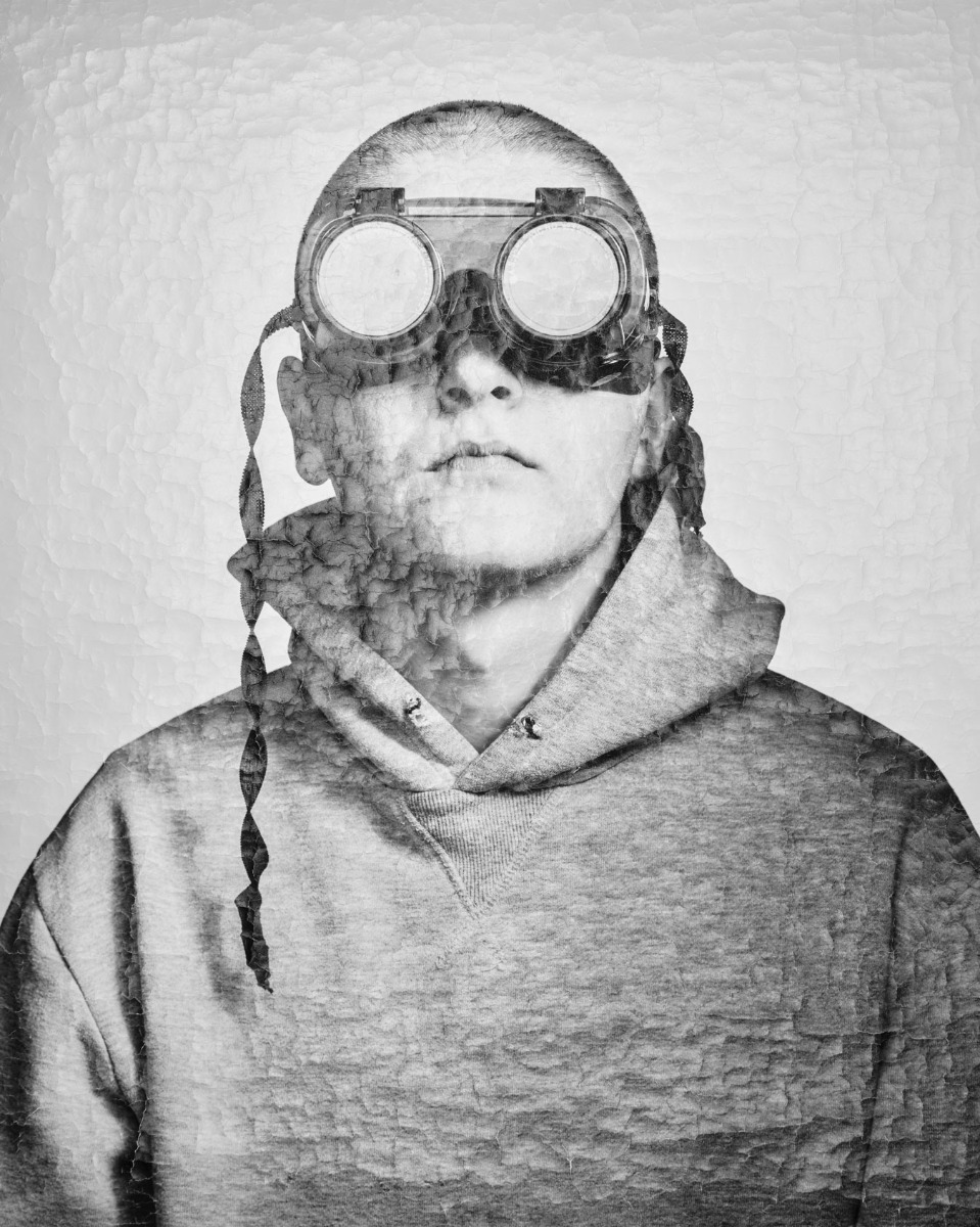 boy-in-goggles-black-and-white-photo-crumpled-surface