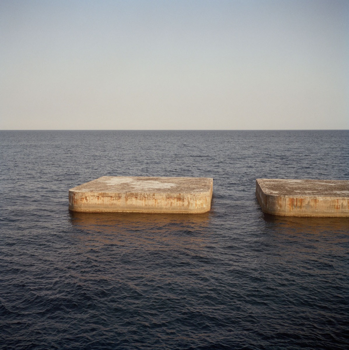 blocks-amidst-a-wody-of-water-sky-horizon