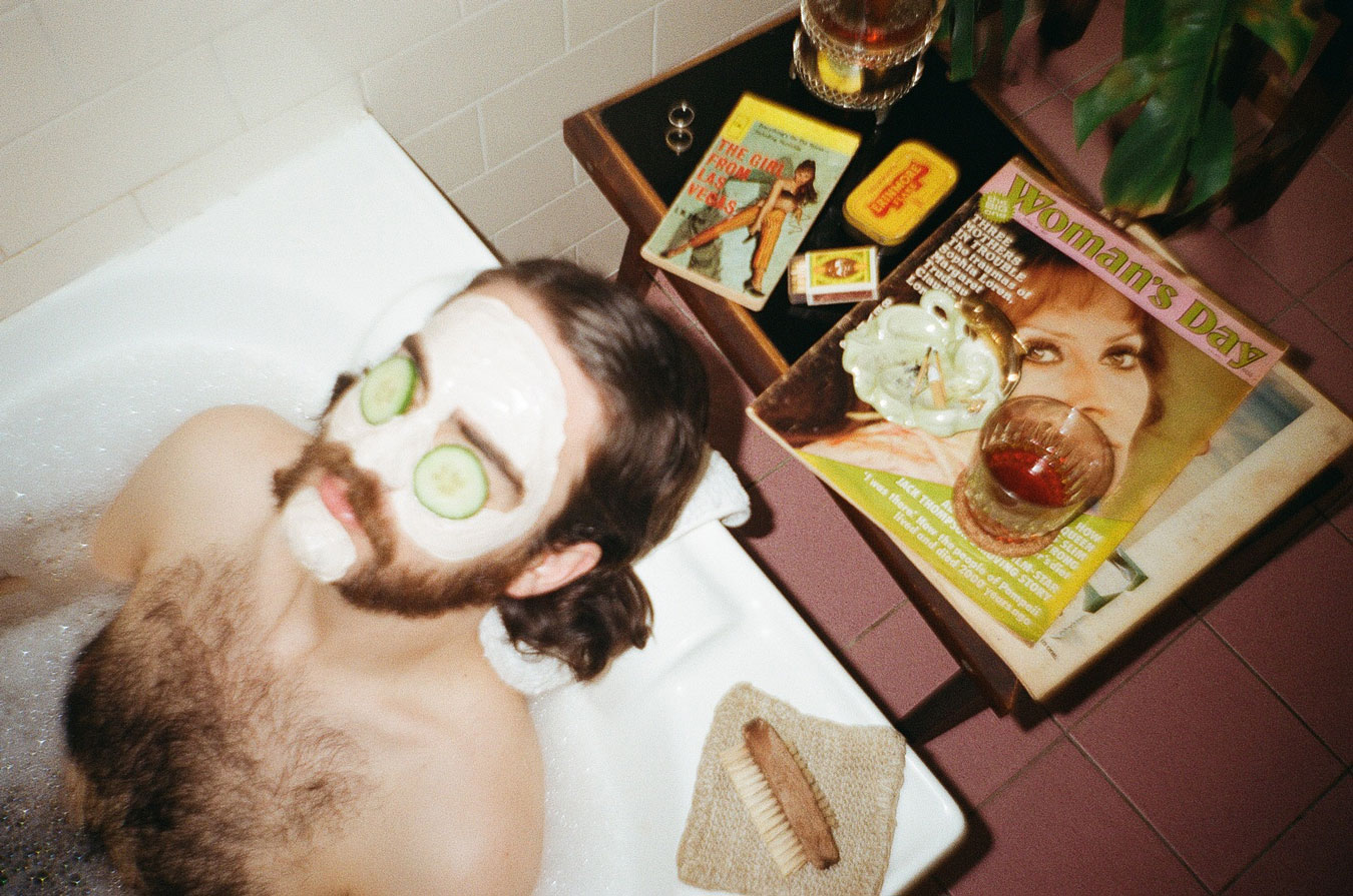 shot-on-film-image-of-man-in-bathtub-cucumbers-on-his-eyes-and-a-facial