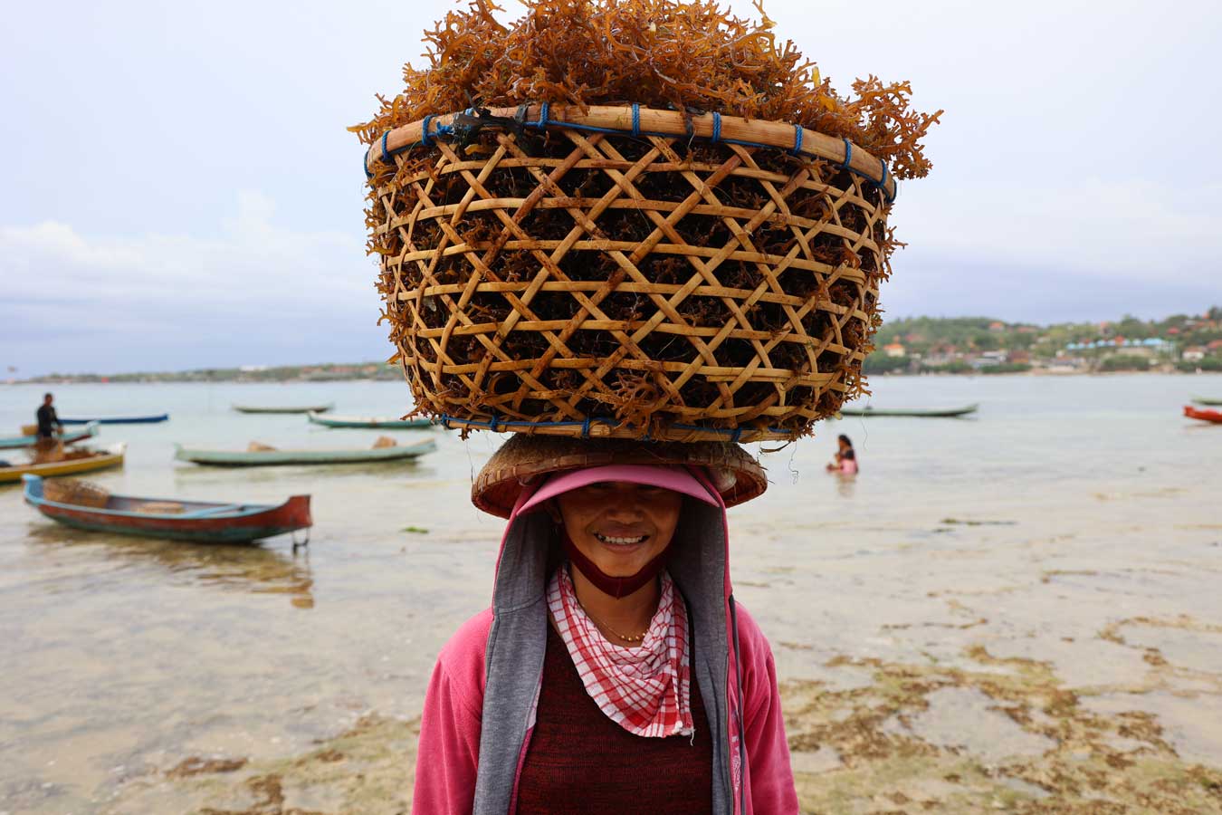 seaweed-farmer-with-basket-on-her-head-in-bali