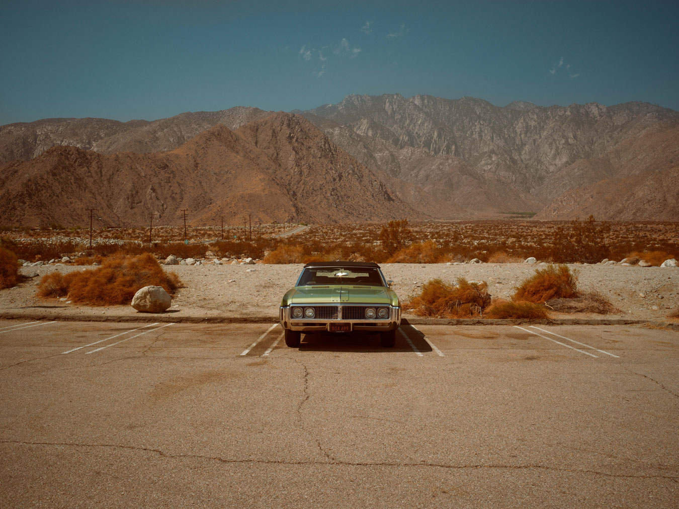 buick-car-parked-in-the-middle-of-the-desert