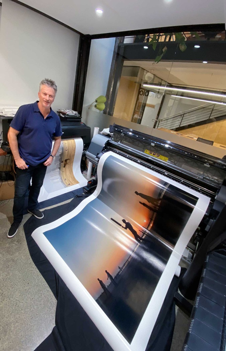 Cricketer-steve-waugh-standing-with-giant-exhibition-print