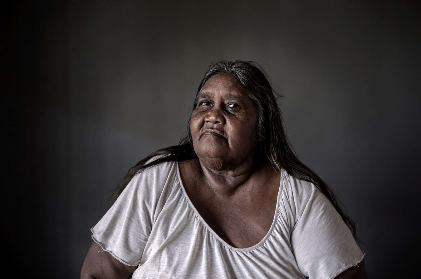 indigenous-australian-woman-in-white-tshirt-eyes-to-camera