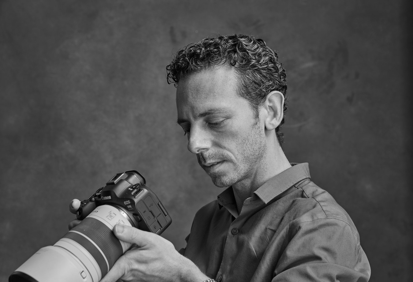 black-and-white-portrait-of-Marc-Giammetta-looking-down-at-camera-body