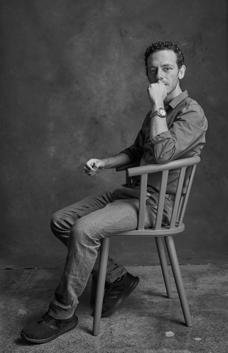 black-and-white-portrait-of-Marc-Giammetta-seated-in-front-of-canvas