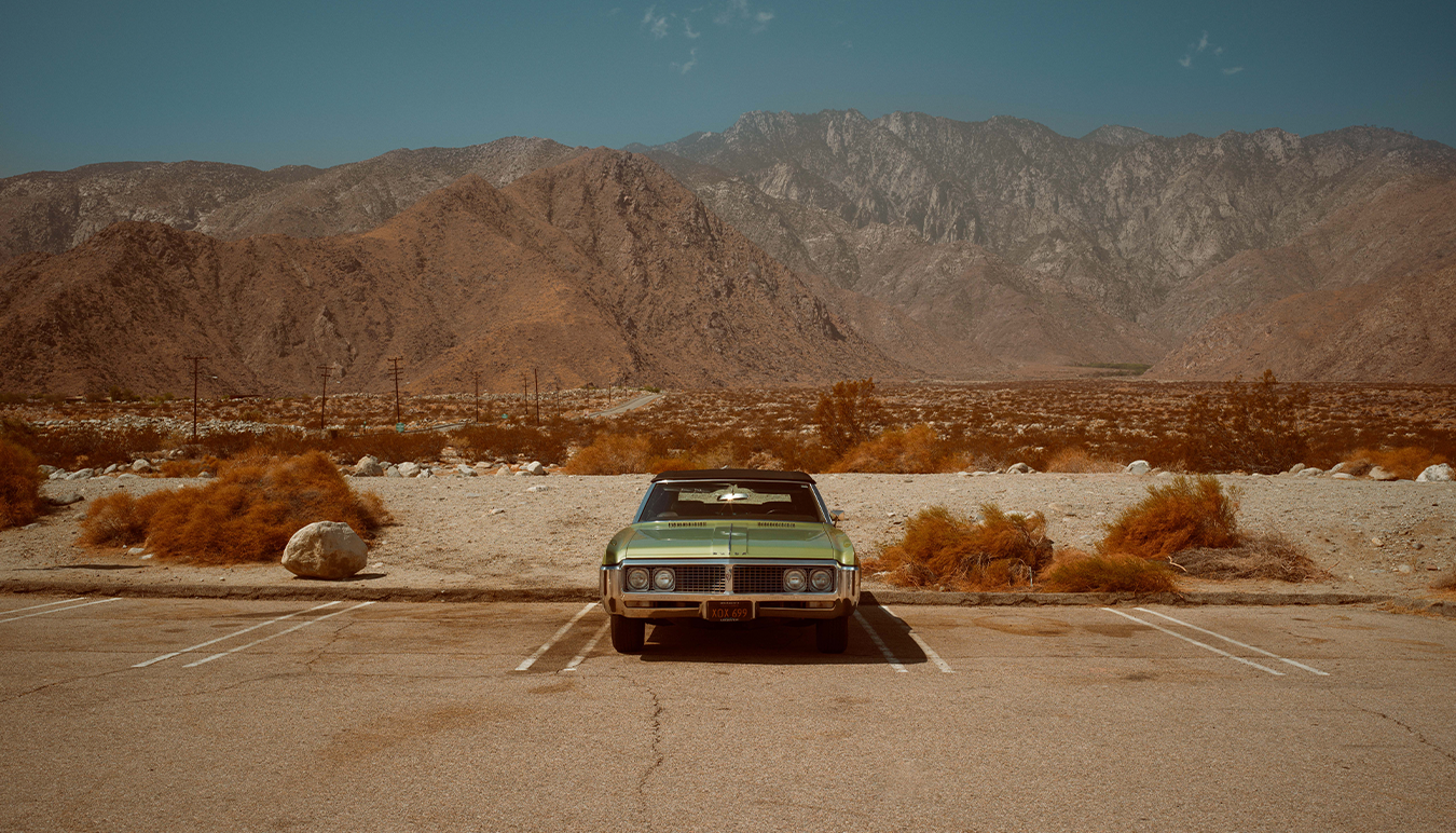 buick-car-parked-in-the-middle-of-the-desert